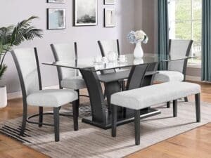 A dining room table with two chairs and a bench.