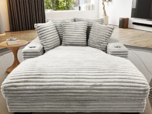 A large white couch in the middle of a room.