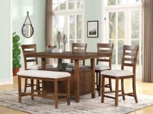 A dining room table with four chairs and two benches.