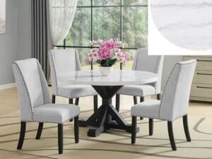 A dining room table with white chairs and a vase of flowers.