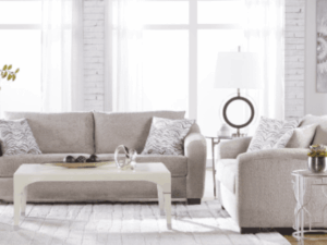 Beige sofa and loveseat in living room.