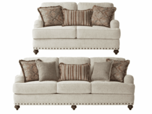 Beige sofa and loveseat set with pillows.