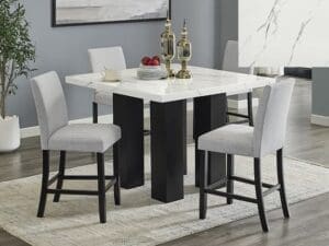 White marble dining table with gray chairs.