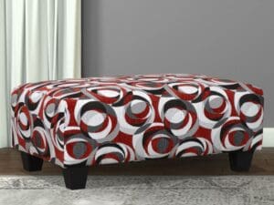Red, gray, and black patterned ottoman.