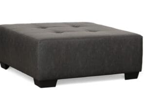 Dark gray tufted square ottoman.