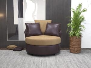 Brown and beige swivel chair with pillows.