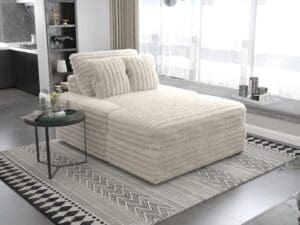 Cream fluffy chaise lounge with pillows.