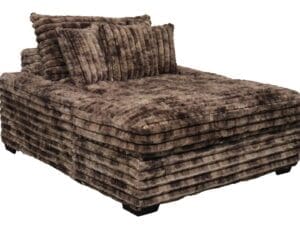 Brown corduroy chaise lounge with pillows.
