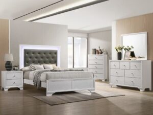 White bedroom furniture set with headboard.
