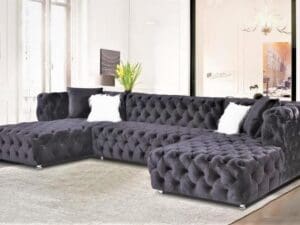 Dark gray velvet sectional sofa.