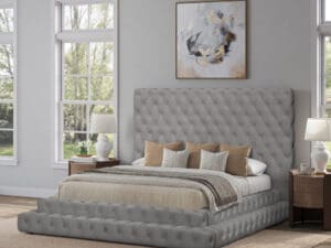 Gray tufted upholstered platform bed.